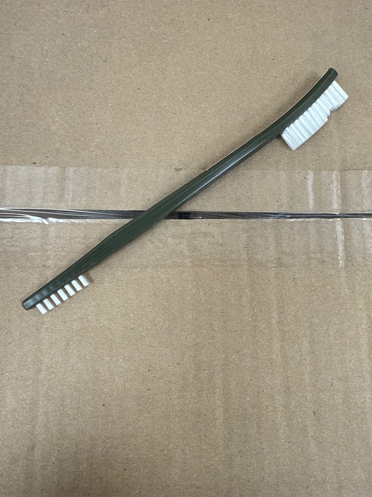 Small Gray Double Sided White Bristle Brush